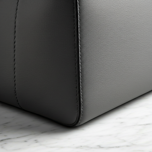Flawless hand-painted edge and precise, minimalist stitching of a Wristlet handbag